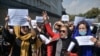 Afghan women take part in a protest march for their rights under the Taliban rule in the downtown area of Kabul on September 3. 