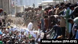 Afghans crowded outside Kabul Airport's Abbey Gate on August 26, 2021, prior to the devastating attack.