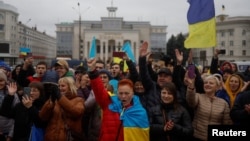 Local residents take to the streets to celebrate Russia's retreat from Kherson on November 13. 