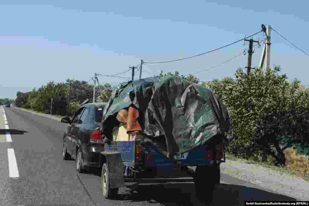 Local residents continue to leave. There are many cars with trailers loaded with belongings on the roads out of the city.