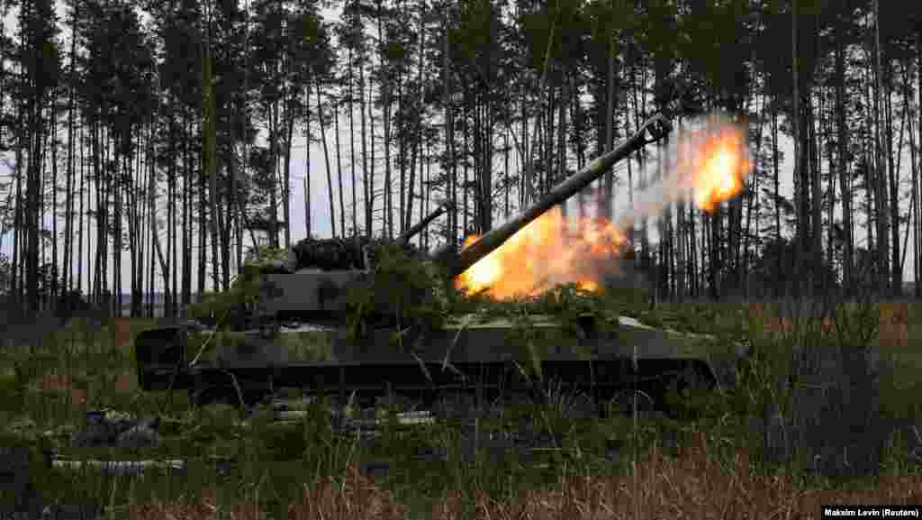 Ukrainian armed forces fire self-propelled howitzers at Russian positions outside Kyiv on March 6.