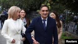 Alexandr Stoianoglo walks with his family in Chisinau on October 20.