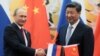 Chinese President Xi Jinping attends a signing ceremony with Russian President Vladimir Putin (left) at the Great Hall of the People in Beijing in September 2015.