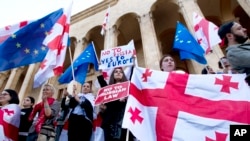 Protesters gather outside the parliament building in Tbilisi on April 15 to protest the country's "foreign-agent" law.