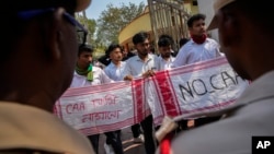 Students protest against the Citizenship Amendment Act in Guwahati, India, on March 12. The new rules implemented by New Delhi on March 11 exclude Muslims, who are the majority in all three countries. 