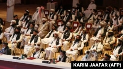 Members of the Taliban delegation attend the opening session of the peace talks between the Afghan government and the Taliban in the Qatari capital, Doha, on September 12, 2020.