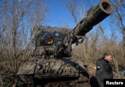 Ukrainian soldiers operate a German-made Leopard 1A5 tank in the Donetsk region, eastern Ukraine, on February 9.