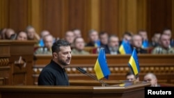 Ukrainian President Volodymyr Zelenskiy addresses lawmakers as he presents his "victory plan" during a parliament session in Kyiv on October 16.