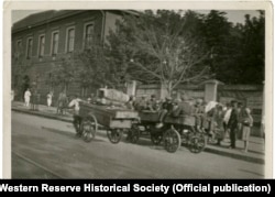 Another photo taken by Whiting in Kharkiv in August 1933 that appeared in the British press. The original photo has this handwritten description on its reverse side: "The wagon of the boy-catcher -- gathering up some of the 18,000 boys reported left last winter in [Kharkiv] by their parents."