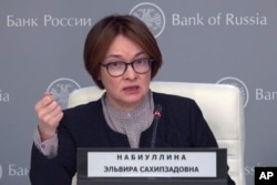 Russian central bank chief Elvira Nabiullina holds a news briefing after a board meeting where the financial regulator raised the key interest rate to 21 percent, in Moscow on October 25.