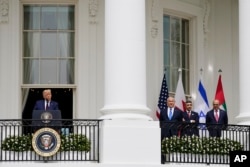 Trump (left) speaks during the Abraham Accords signing ceremony in Washington in September 2020 while Netanyahu, United Arab Emirates Foreign Minister Abdullah bin Zayed al-Nahyan, and then-Bahraini Foreign Minister Khalid bin Ahmed Al Khalifa look on.