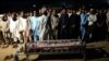 Locals from Gwadar attend the funeral for a victim of the August 20 attack claimed by the Balochistan Liberation Army (BLA).