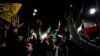 Iranian demonstrators chant slogans during an anti-Israeli gathering in front of the British Embassy in Tehran early on April 14.