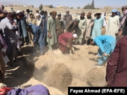 Mourners attend the funeral of victims killed in a suicide bomb blast at a hotel in Quetta, the provincial capital of Balochistan Province, in April 2021.