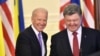 Ukrainian President Petro Poroshenko (right) and U.S. Vice President Joe Biden smile prior to speaking to the press following talks in Kyiv in November 2014.