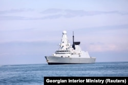 The British Royal Navy warship HMS Defender approaches the Black Sea port of Batumi on June 26.