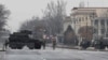 Kazakh soldiers stand guard at a checkpoint in Almaty on January 7.