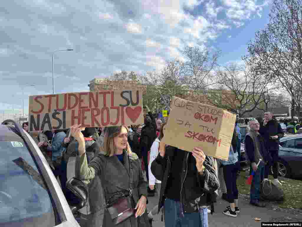 Protesters hold signs declaring &quot;Students are our heroes&quot; and &quot;Where students look, I jump,&quot; ahead of the march.&nbsp; &nbsp;