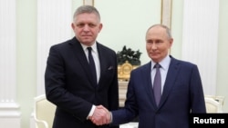 Slovak Prime Minister Robert Fico (left) meets Russian President Vladimir Putin at Kremlin.