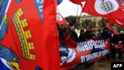 Supporters of Russia's Other Russia party take part in a rally in St. Petersburg on February 23 in support of the forces in eastern Ukraine and southern Russia pressing for a united "Novorossia" under Russian rule.