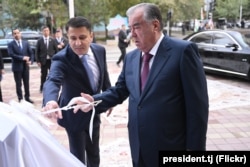 Muhammad Mirzo, head of Avesto Group (left) attends an official event with President Emomali Rahmon in Dushanbe in October 2023.