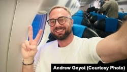 Belarusian activist Andrey Hnyot celebrates during his flight out of Serbia on October 31.