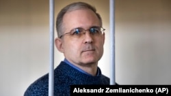 Paul Whelan stands in the defendant's cage while waiting for a hearing in a courtroom in Moscow in August 2019.