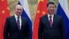 Russian President Vladimir Putin meets with Chinese President Xi Jinping in Beijing on February 4. The Ukraine crisis is a test for Beijing and Moscow’s warming ties -- one that analysts believe China and Russia will pass.
