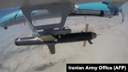 A handout picture provided by the Iranian Army's official website shows an Iranian Simorgh drone carrying a weapon during a military exercise in September 2020.