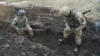 Ukrainian soldiers dig trenches near a frontline position in eastern Ukraine. (file photo)