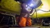 A photo taken on September 9 shows a specialist welding a pipe during the final stage of the Nord Stream 2 pipeline construction in the Baltic Sea.