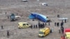 Kazakh emergency specialists work at the crash site of a passenger plane near Aqtau on December 25.