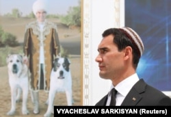 Serdar Berdymukhammedov in front of a portrait of his father, Gurbanguly Berdymukhammedov. (file photo)