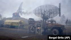 Damaged radar arrays and other equipment is seen at a Ukrainian military facility outside Mariupol on February 24.