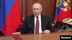 Russian President Vladimir Putin spoke in an address aired before dawn on February 24 in which he said Moscow would press for the “demilitarization” of Ukraine and hinted that the Kremlin may be out for regime change.