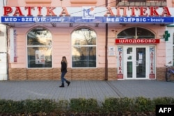 A picture taken in November 2017 shows signs in two languages, Ukrainian and Hungarian, at a pharmacy in Berehove, a small town in western Ukraine.