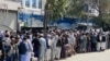 Afghans lined up to withdraw money from banks in Kabul on September 1 as financial institutions imposed limits of $200 in withdrawals per week.