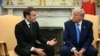 U.S. President Donald Trump (right) meets with French President Emmanuel Macron at the White House on February 24.