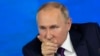 Russian President Vladimir Putin gesticulates during his annual news conference in Moscow on December 23.