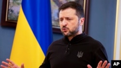 Ukrainian President Volodymyr Zelenskyy talks to reporters in Kyiv on February 19.