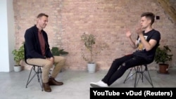 Russian opposition politician Aleksei Navalny speaks during an interview with prominent Russian YouTube blogger Yury Dud in Berlin on October 6.