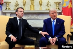 French President Emmanuel Macron and U.S. President Donald Trump meet at the White House on February 24.