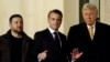 French President Emmanuel Macron (center) meets with U.S. President-elect Donald Trump (right) and Ukrainian President Zelenskiy in Paris on December 7.