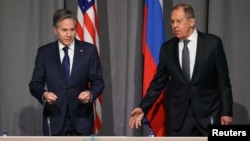 U.S. Secretary of State Antony Blinken (left) attends a meeting with Russian Foreign Minister Sergei Lavrov on the sidelines of the OSCE Ministerial Council in Stockholm on December 2.