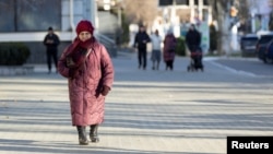 Residents bundle up in Tiraspol, the capital of Moldova's breakaway region of Transdniester, on January 4.