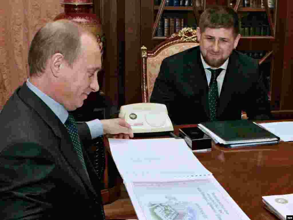 Putin meets with then-Chechen Prime Minister Ramzan Kadyrov at the Kremlin in May 2006.