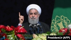 Iranian President Hassan Rohani delivers a speech during a rally marking the 39th anniversary of the 1979 Islamic Revolution in Tehran on February 11.