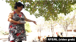 Vasila Mammadova in the yard of her house in Pirshagi, Azerbaijan.