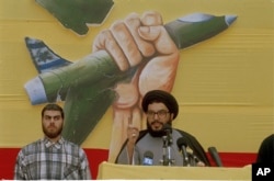 Hassan Nasrallah (right), seen here addressing a crowd in Beirut in July 1994, was picked as Hezbollah's leader at the age of 32.