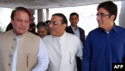 Sharif (left) and Zardari (center) appear to have widely divergent goals.